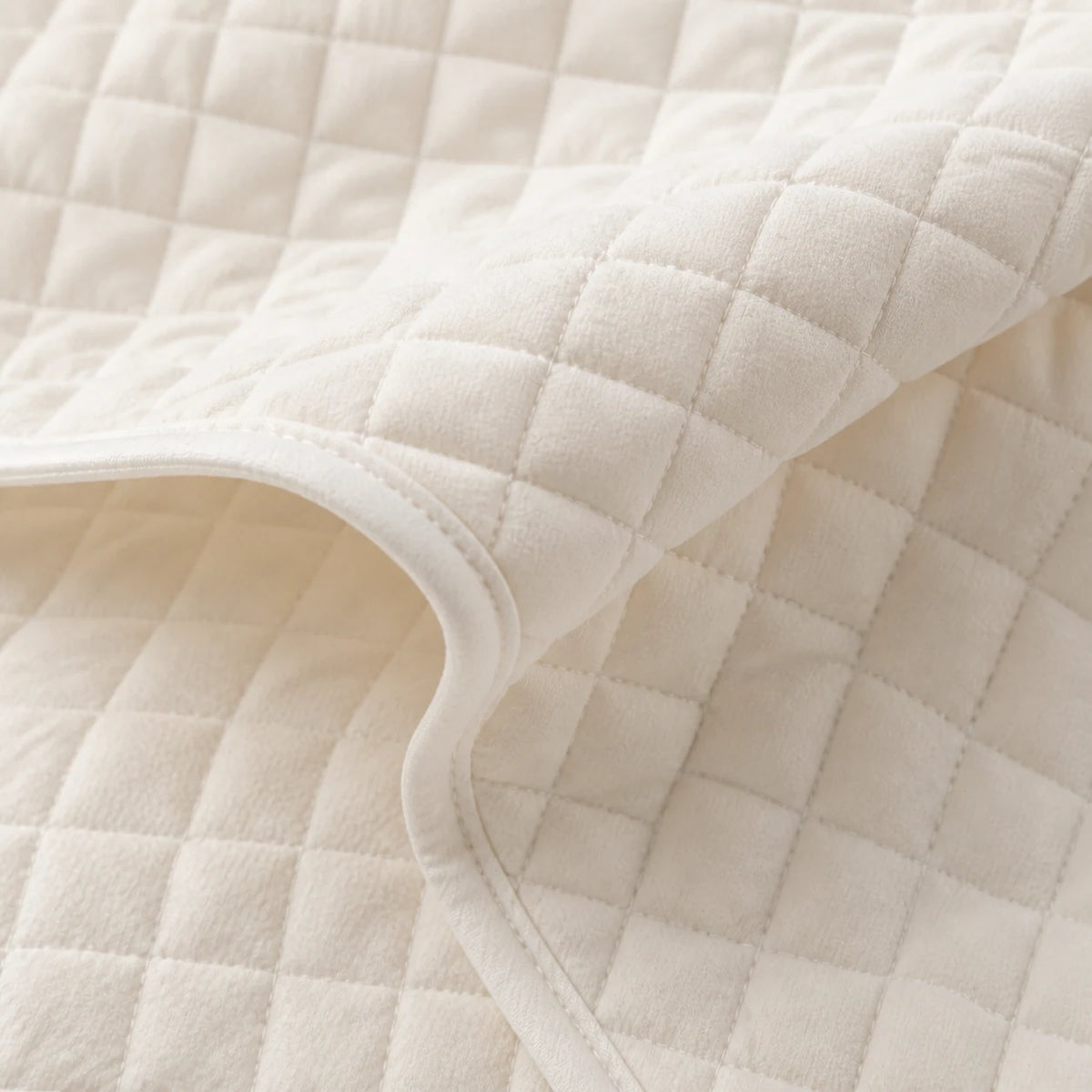 Soft quilted bedding protection layer